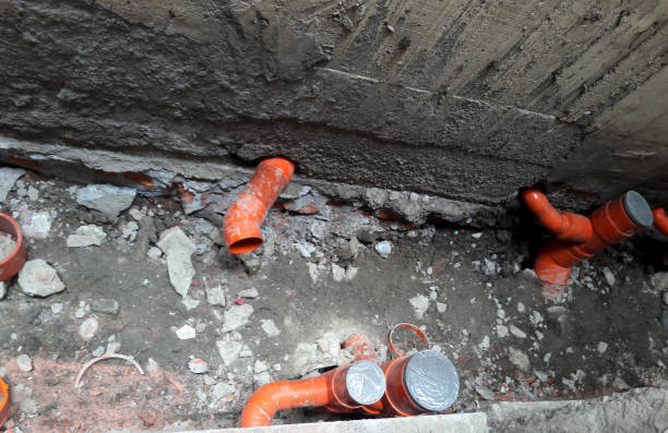 istock Home sewer sewage pipe construction. Newly installed ductwork. The sewer lines are developed and installed at the construction site. Brand new orange PVC plastic drain. Taiwan 1447560545