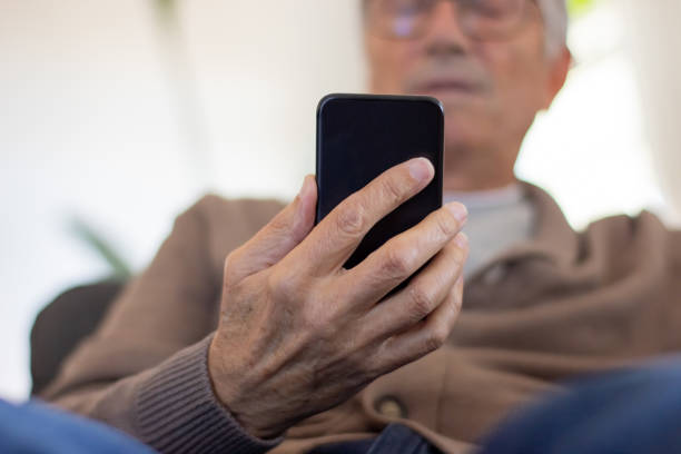 istock Closeup of man using smartphone 1447565532