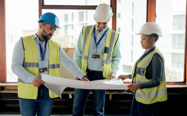 istock Blueprint, planning and construction worker, architect and engineer with paper, strategy and teamwork for building design. Architecture team talking, maintenance and strategy for development project 1447566146