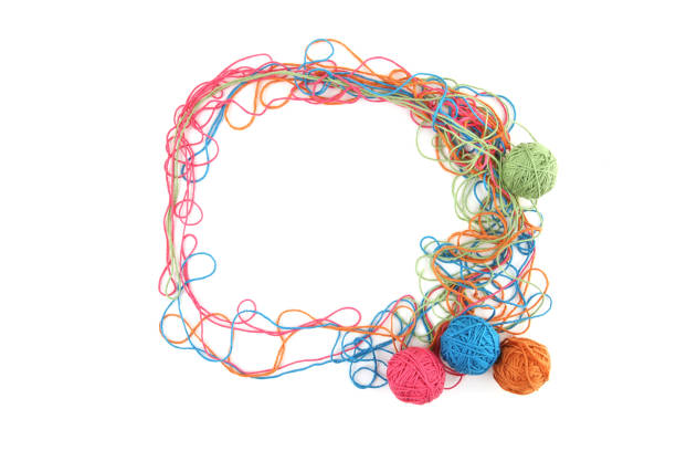istock Circe of tangled colorful cotton threads isolated on white background. 1447581227