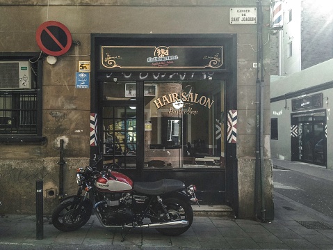– December 04, 2021: Classic black motor bike parked in the street. Triumph Boneville
