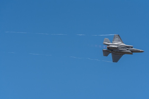 Layton, United States – June 25, 2022: An air force F-35 from a demonstration team performs aerobatics at Hill AFB