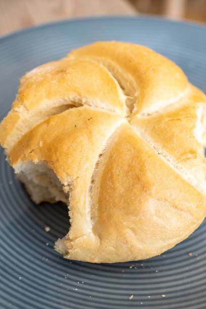 istock Top view of a bitten bun on a plate 1447585437