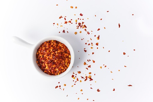 A food background with spices on a white table