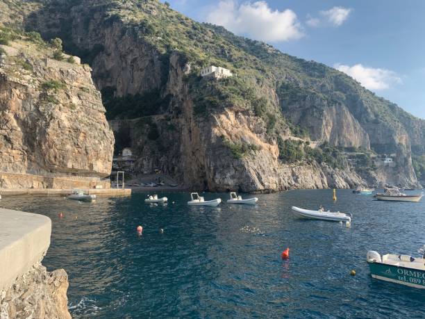 Praiano Bay from the boardwalk Boats in the Harbour, Praiano Italy praiano photos stock pictures, royalty-free photos & images