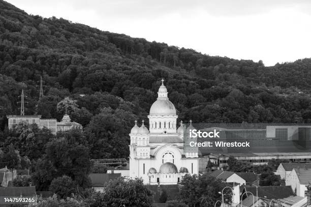 Monochrome Shot Of An Orthodox Church With Forest Trees In The Background Stock Photo - Download Image Now