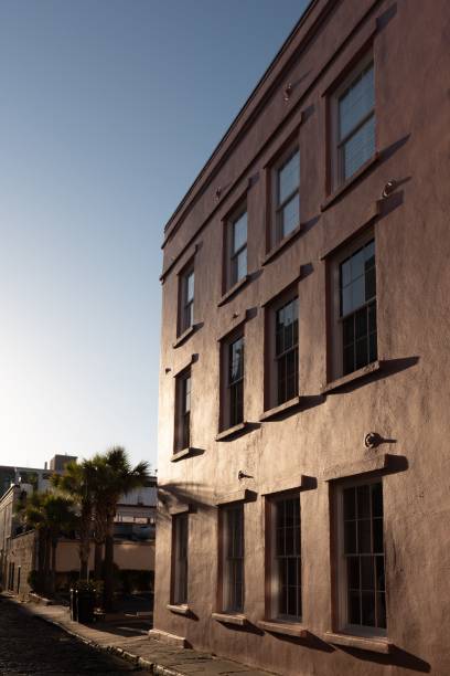Vertical low-angle of a sunlit building clear sky background