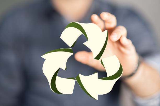 istock Person pointing to a 3D rendered recycle sign 1447594921