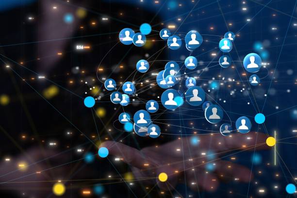 istock Businessman showing a 3D rendered network with user icons in a cyberspace 1447594928