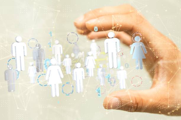istock Businessman showing a 3D rendered network with user icons in a cyberspace 1447595037