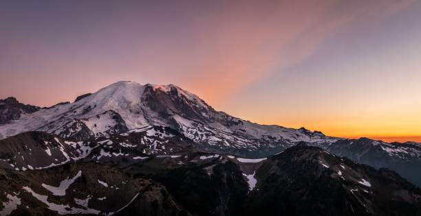 istock Beautiful soft pink sunset over the snowy Mount Rainier 1447595056