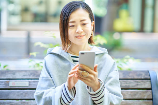 istock Woman looking at smartphone screen 1447595265