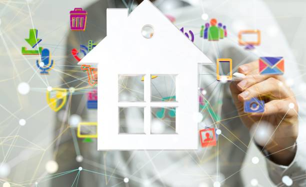 istock Person showing a house icon with connections on a blurred background 1447595526