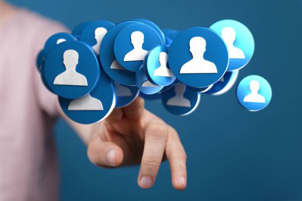 istock Person showing 3d human icons on a blurred background 1447595557