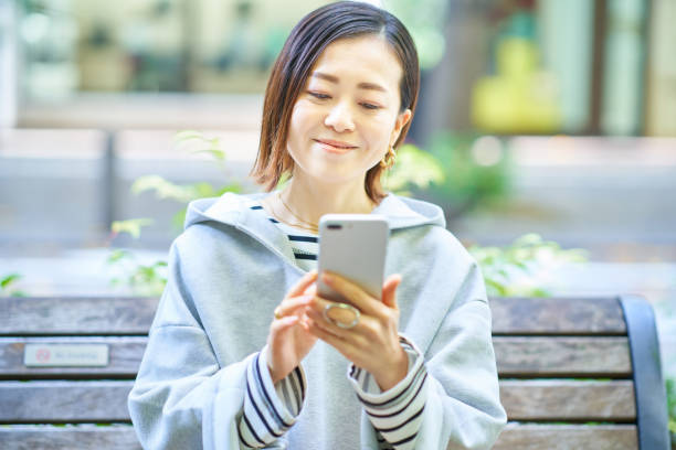 istock Woman looking at smartphone screen 1447595871