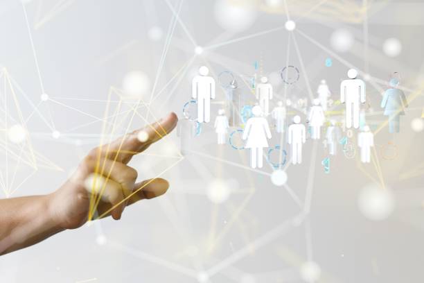 istock Man reaching for the illustrated people icons 1447596366