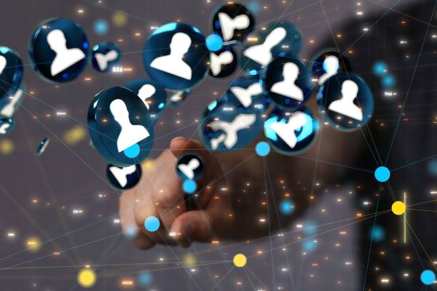 istock Hand pointing at hovering profile icons. Social media concept. 1447598225