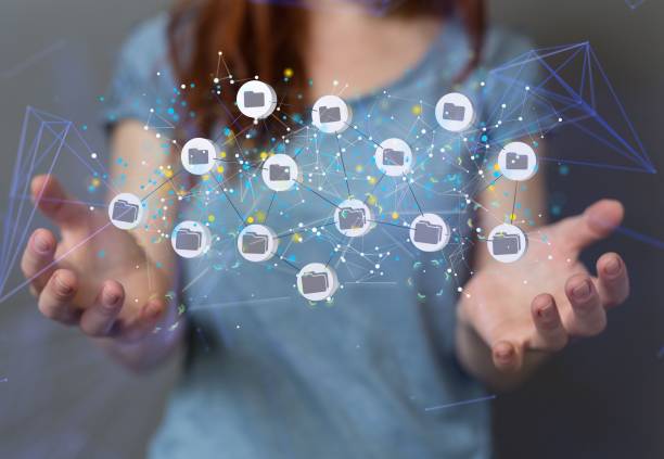 istock Concept of big data cloud -  digital 3d icons of connected files floating between hands 1447598409