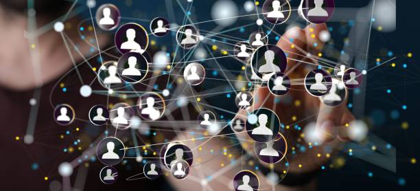 istock Finger pointing on 3d floating connected people icons - a concept of networking, HR, communication 1447598665