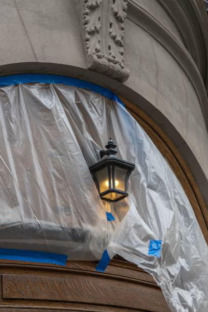 istock Old door of building under renovation with protective covering 1447599765