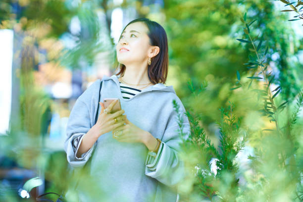 istock Woman looking at smartphone screen 1447600935