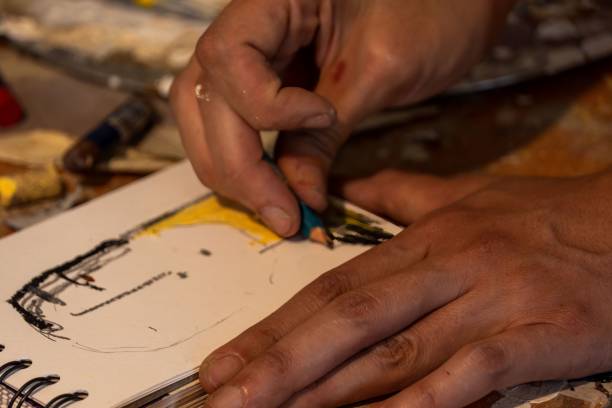 istock High-angle view of hands sketching on a sketchbook 1447603482