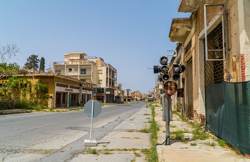 Varosha, Cyprus – April 26, 2022: Abandoned avenue with empty buildings in the beach resort of Varosha, Cyprus