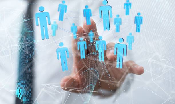 istock 3D rendering of people figures with a man in the background pointing at it 1447609290