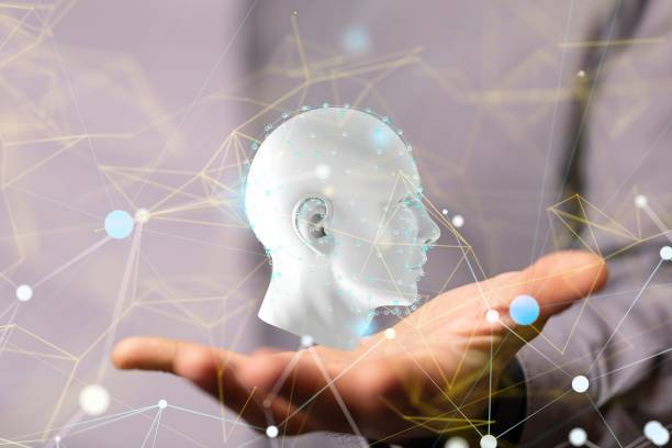 istock 3D rendering of a human face with floating lines and dots in a man's hand 1447609292