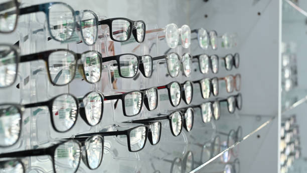 Image of spectacles on shelf in optical store. Optics, health care and vision concept. stock photo