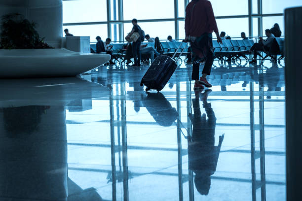 istock People in airport corridor 1447611435