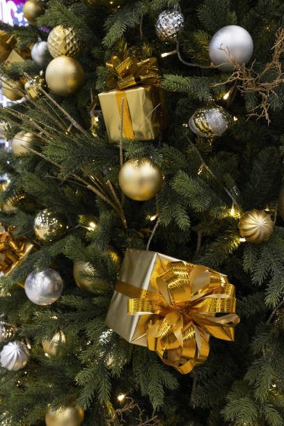 istock Yellow shiny star decoration on the Christmas tree 1447613319