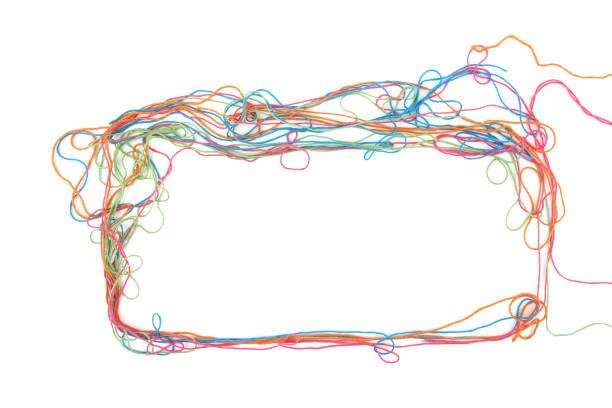 istock Frame of tangled colorful cotton threads isolated on white background. 1447614246