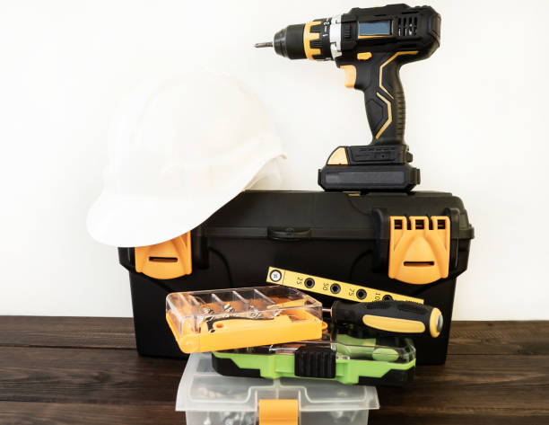 istock Open toolbox, construction safety helmet. Cordless, cordless drill. A set of construction tools and goods for repairs. Professional repair equipment. 1447616009