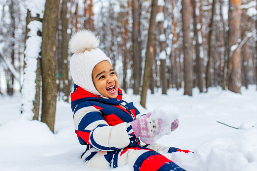 happy little girl enjoy a sleigh ride on christmas holidays.