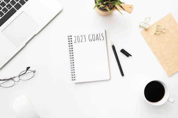 istock Notebook with 2023 goals text on it to apply new year resolutions and plan. 1447617930