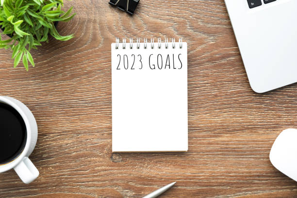 istock Notebook with 2023 goals text on it to apply new year resolutions and plan. 1447618138