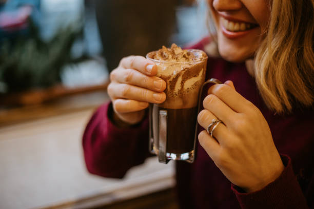 istock Happy Woman Drinking Hot Chocolate 1447621620