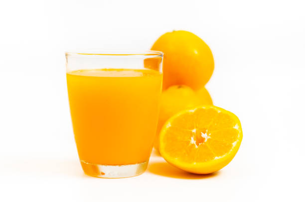 Freshness orange juice in clear glass,Orange and slice orange on white background.