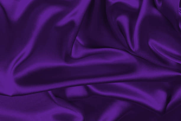 istock Rich and luxury red silk fabric texture background. 1447623347