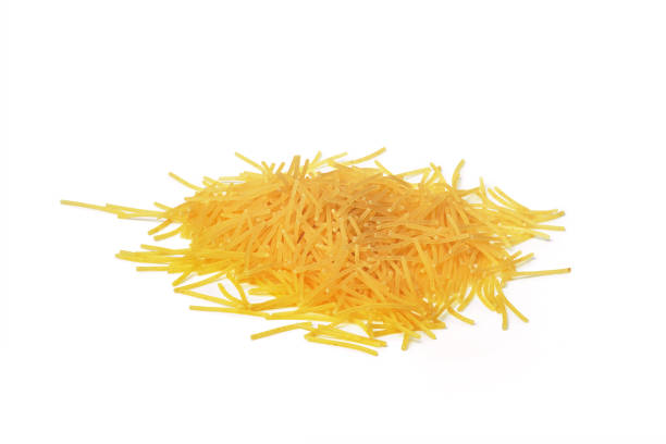 istock uncooked whole grain pasta on white background 1447628838