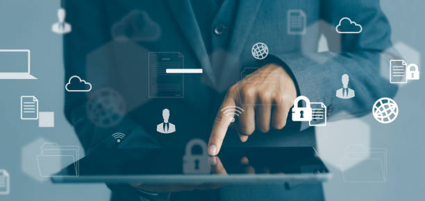 istock Asian businessman holding and touching on tablet screen with computing icon online. 1447628860