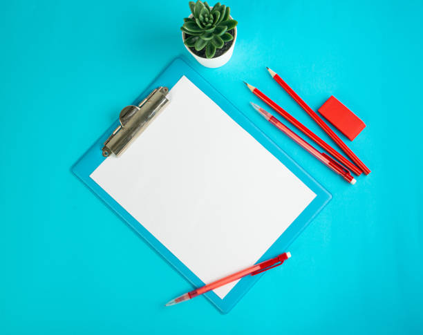 istock Blank Paper Tablet Top View, Empty White Sheet on Blue Table Flat Lay Mockup, Paper Tablet Texture Background 1447633914