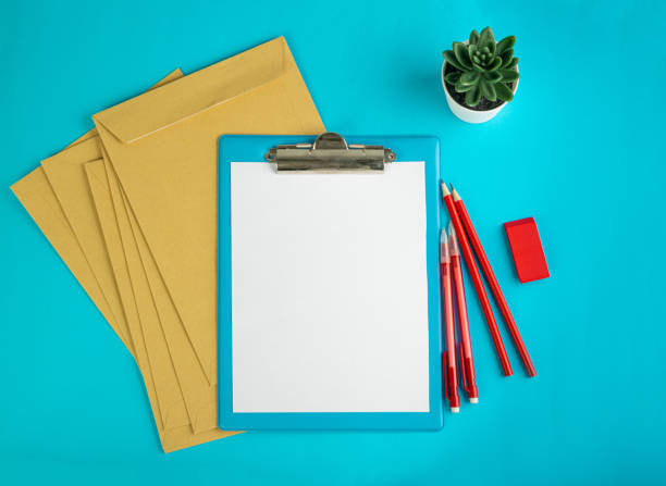 istock Blank Paper Tablet Top View, Empty White Sheet on Blue Table Flat Lay Mockup, Paper Tablet Texture Background 1447633941
