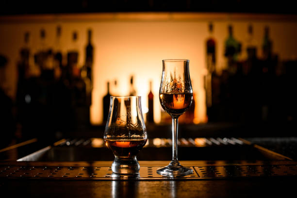 istock great view on stemware and glass with alcoholic drinks on bar counter. 1447634643