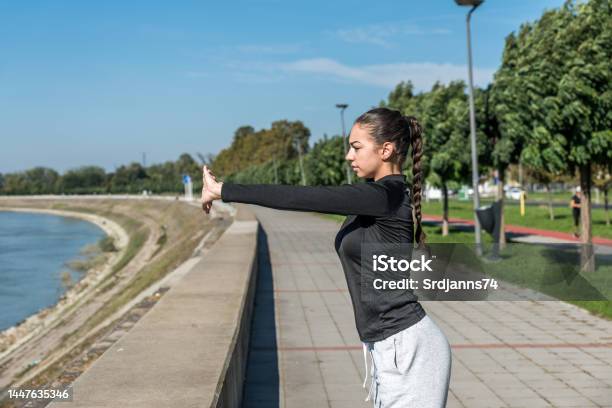 Young Self Loved Teenage Girl Fitness Exercises Outdoor As Morning Routine For Selfawareness Of Healthy Life Good Posture Woman Stretching Her Muscles Before Workout Training Stock Photo - Download Image Now