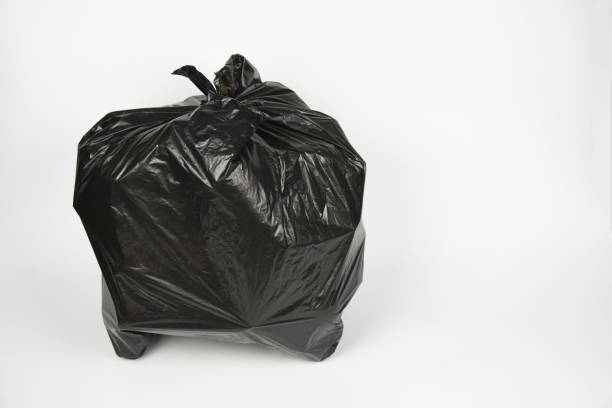 istock plastic bottles in black garbage bag  for recycling 1447639523