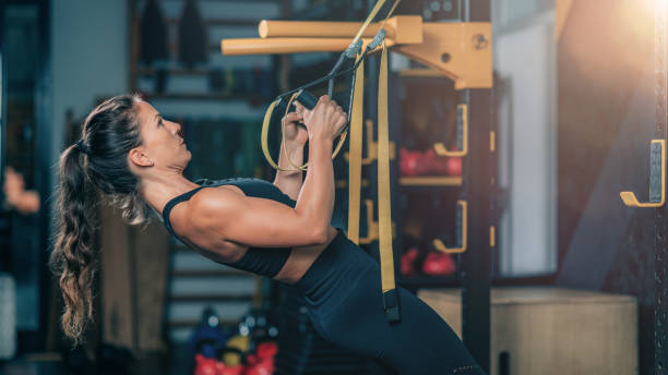 suspension training exercise in the gym. stock photo