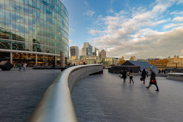 istock Blurred motion of people walking with financial district beyond 1447645656