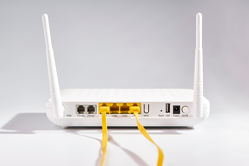 Modern white wi-fi router. Connection and communication concept
